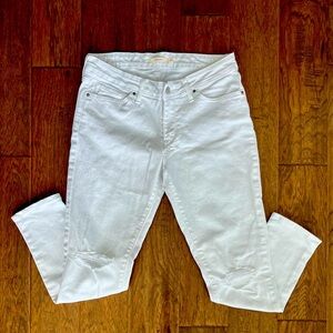 Women’s Levi white jeans with torn knees